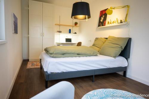 Ένα ή περισσότερα κρεβάτια σε δωμάτιο στο Fortuna Park Residence & Private Parking