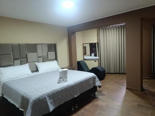 Postel nebo postele na pokoji v ubytování Kapricho Wanka