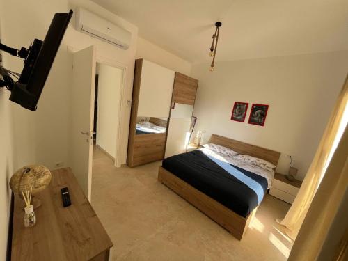 En eller flere senge i et værelse på Capitan Nicki