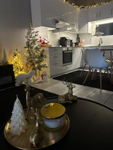 a kitchen with a christmas tree and a table at RHODESIA guest house in Chalkida