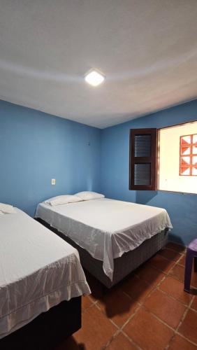 En eller flere senge i et værelse på Verdelândia Guaramiranga - Apartamento com 2 quartos