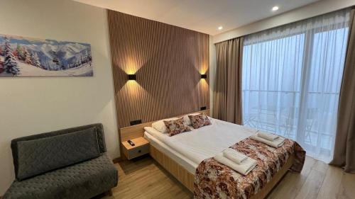 Postel nebo postele na pokoji v ubytování Gudauri Twins 404