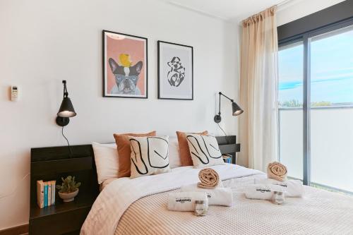 En eller flere senge i et værelse på Las Dunas 214 - by Welcomely