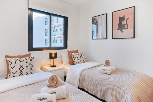 En eller flere senge i et værelse på Las Dunas 214 - by Welcomely