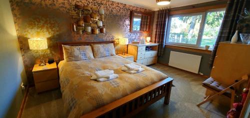 Ένα ή περισσότερα κρεβάτια σε δωμάτιο στο Torcroft Lodges