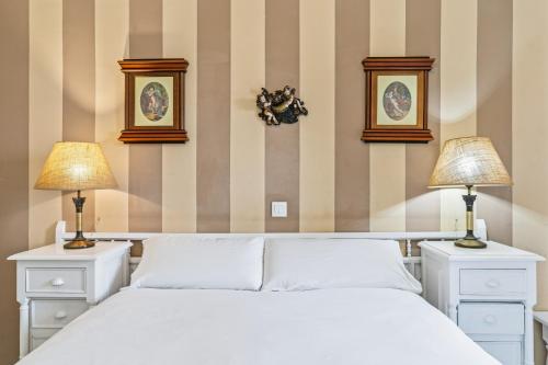 En eller flere senge i et værelse på Relax Beach