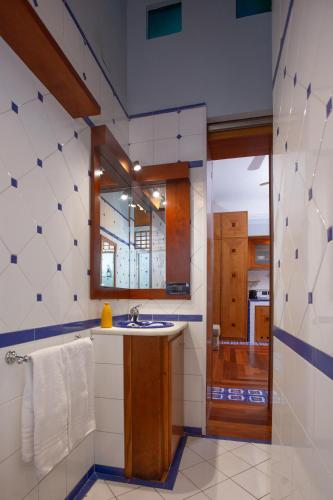 a bathroom with a sink and a mirror at ArtStay Apt Sempione, Near Metro, City Centre in Milan