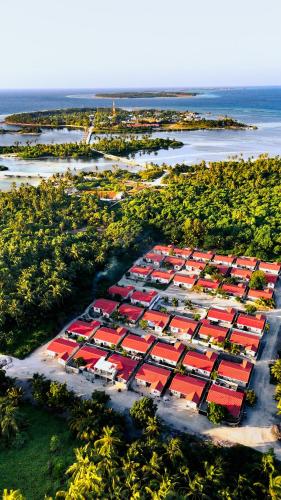 an aerial view of a large parking lot with red roofs at Seaside in Kaadedhdhoo Airport
