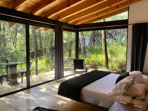 Ένα ή περισσότερα κρεβάτια σε δωμάτιο στο Xomue