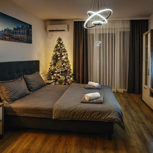 En eller flere senge i et værelse på Royal Apartmani 1