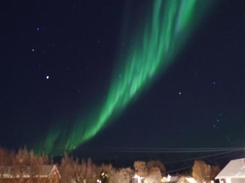 an image of the northern lights in the sky at Lyngen accommodation and sauna in Lyngseidet