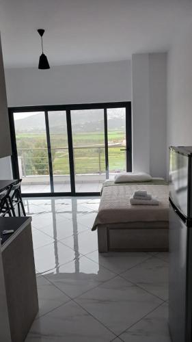 Ένα ή περισσότερα κρεβάτια σε δωμάτιο στο Vana's Apartments