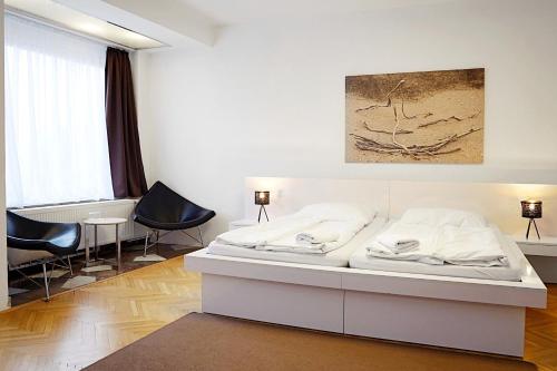 Giường trong phòng chung tại Wellness Hotel Orlík