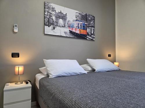 Postel nebo postele na pokoji v ubytování Rho Fiera Flat