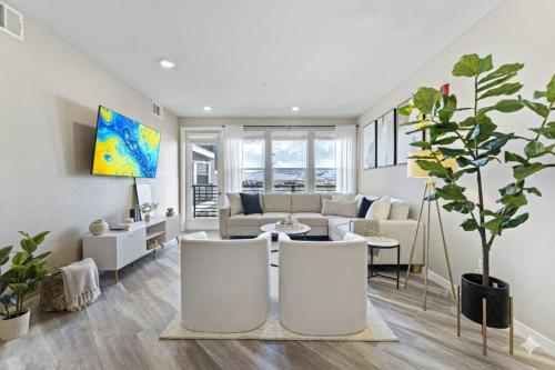 a living room with a couch and a table at Sparks 2BR Water Views - Spring Events & Jacuzzi in Sparks
