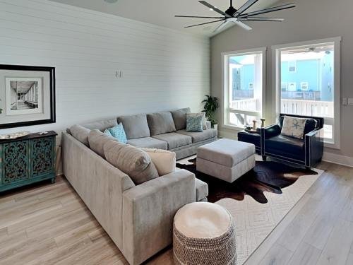 a living room with a couch and a chair at Serenity At Port A in Port Aransas