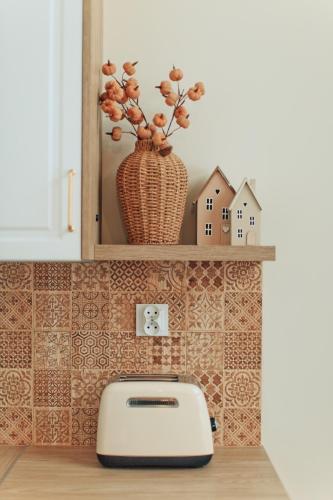 a toaster sitting on a shelf in a kitchen at Polana House in Niedźwiada