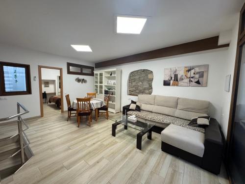 a living room with a couch and a table at La Muralla in Montblanc