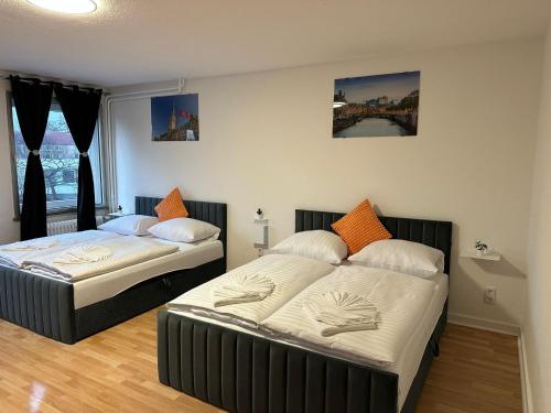 Ένα ή περισσότερα κρεβάτια σε δωμάτιο στο Ferienwohnung im Hamburger Straße 134