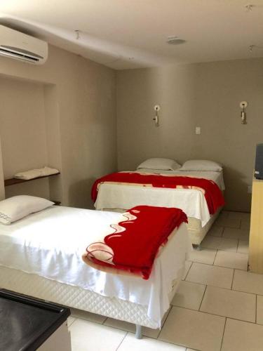 Ένα ή περισσότερα κρεβάτια σε δωμάτιο στο Hotel Comendador Express
