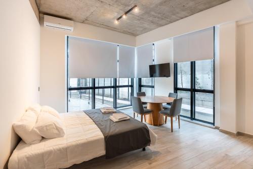 Ένα ή περισσότερα κρεβάτια σε δωμάτιο στο Araucarias Apartamentos