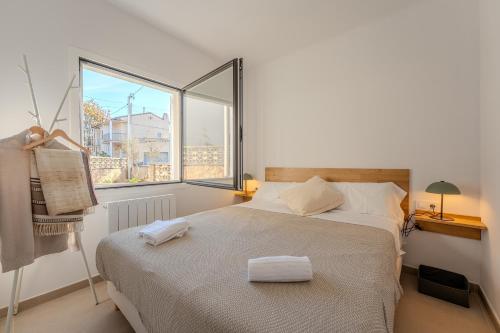 En eller flere senge i et værelse på Casa Carmen Girona