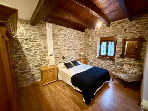 Ένα ή περισσότερα κρεβάτια σε δωμάτιο στο Casa Rural Bango