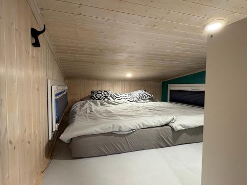 En eller flere senge i et værelse på KE-Tiny Siedlung Haus Charlie