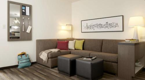 a living room with a couch and a table at Hyatt House At Ho'Opili in Ewa Beach