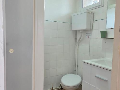 a small bathroom with a toilet and a sink at Studio cosy avec jardin et WIFI à La Roche-Posay - FR-1-541-187 in La Roche-Posay