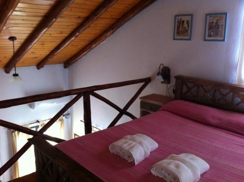 Lova arba lovos apgyvendinimo įstaigoje Bungalows Los Talas de San José