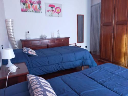 Ένα ή περισσότερα κρεβάτια σε δωμάτιο στο La tua casa meravigliosa con giardino