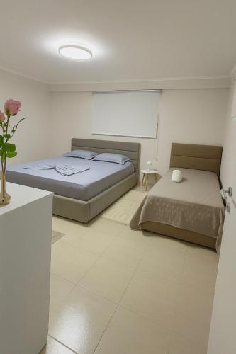 Ένα ή περισσότερα κρεβάτια σε δωμάτιο στο New Bazaar Cozy Villa