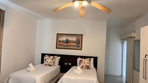 Ένα ή περισσότερα κρεβάτια σε δωμάτιο στο Rehema Sands