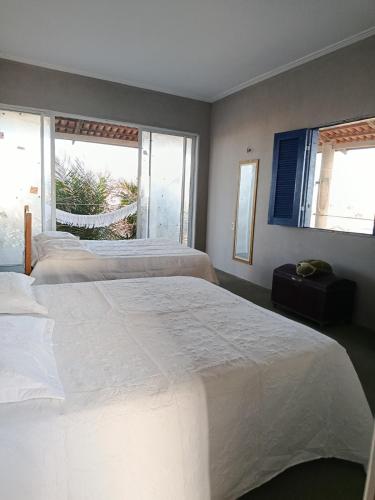 Ένα ή περισσότερα κρεβάτια σε δωμάτιο στο Casa"Taíba Beach House"