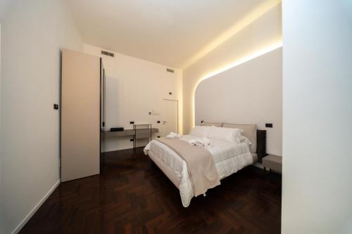 En eller flere senge i et værelse på Donna Isabella - Boutique Rooms