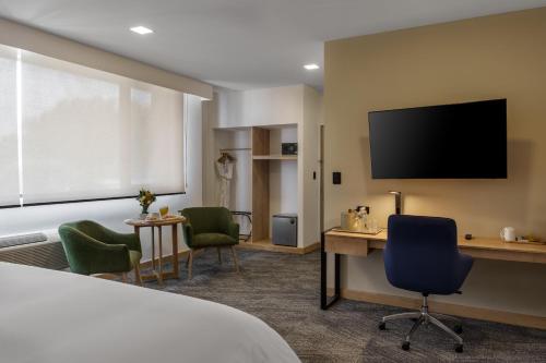 Et tv og/eller underholdning på Best Western Plus Hotel Terraza