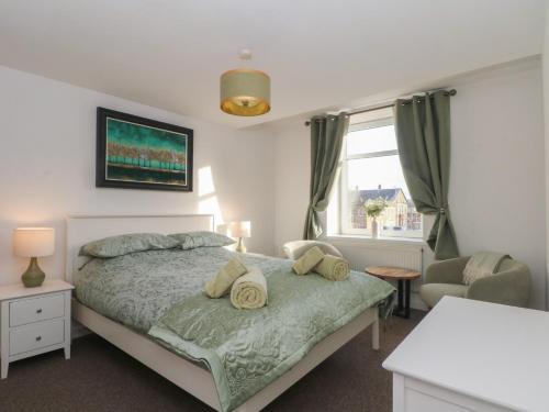 a bedroom with a bed and a window at 32A Bank Street in Rossendale