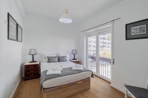 En eller flere senge i et værelse på Lovely Sá - By Y Concept