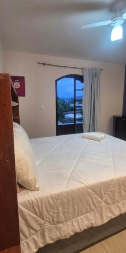 Postel nebo postele na pokoji v ubytování Aconchego III