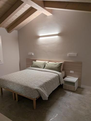 Giường trong phòng chung tại Appartamento Girasole