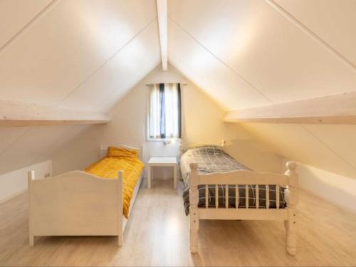 Ένα ή περισσότερα κρεβάτια σε δωμάτιο στο Scheldeoord 54