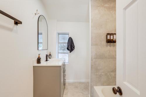 a bathroom with a sink and a shower at Home with Lake Views and Deck in New Jersey Highlands! in Stanhope