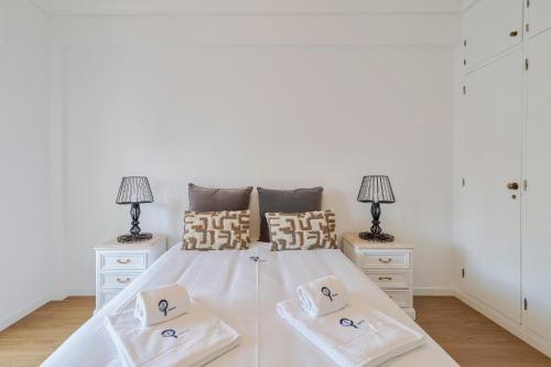 En eller flere senge i et værelse på Lovely Urbisado III - By Y Concept