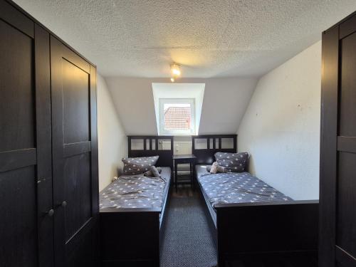 Postel nebo postele na pokoji v ubytování Mikra Homes24 in Meerane