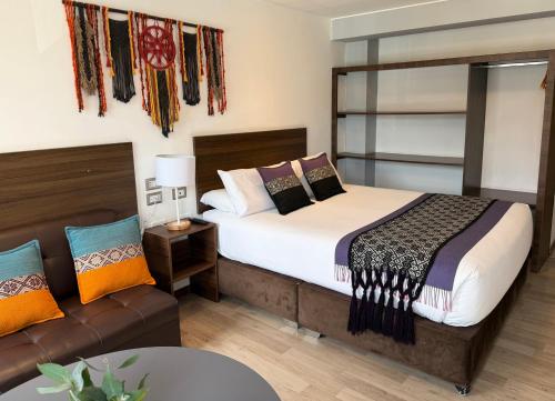 Giường trong phòng chung tại CASA CRISTOBAL Centenario