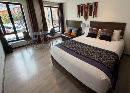 Giường trong phòng chung tại CASA CRISTOBAL Centenario