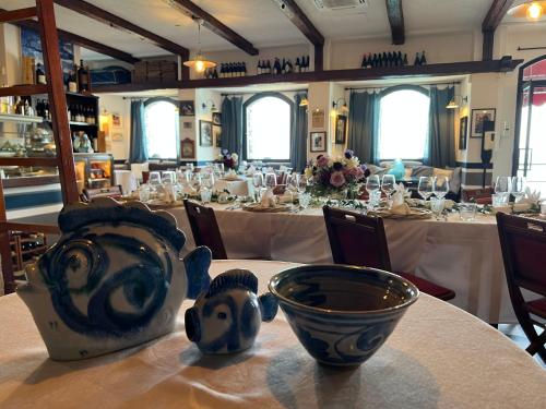 a large dining room with tables with white tablecloths at La Casa Del Doganiere in Monterosso al Mare