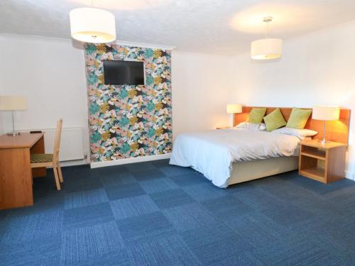 En eller flere senge i et værelse på Bedroom 1