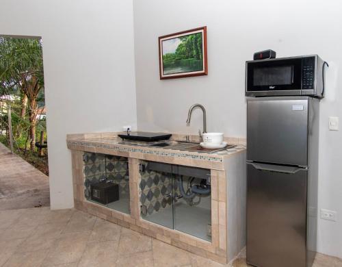 Η κουζίνα ή μικρή κουζίνα στο A Slice of Paradise